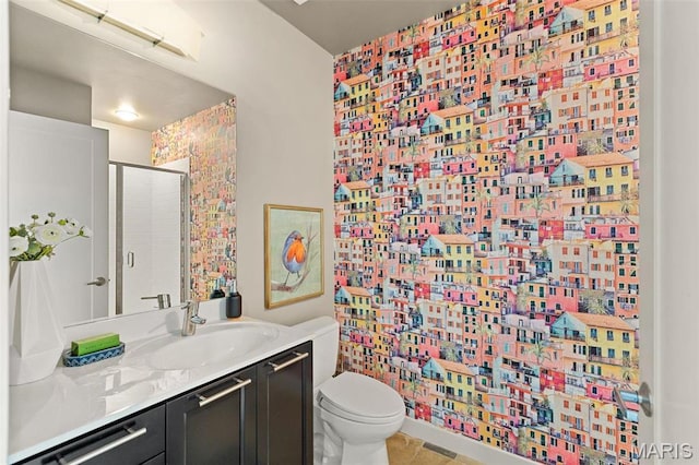 4545 Lindell Blvd Unit 3, Saint Louis, MO 63108 - full bath with vanity, a shower stall, toilet, and wallpapered walls