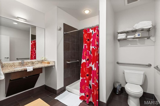 4545 Lindell Blvd Unit 3, Saint Louis, MO 63108 - bathroom with toilet, baseboards, tile patterned flooring, vanity, and tiled shower