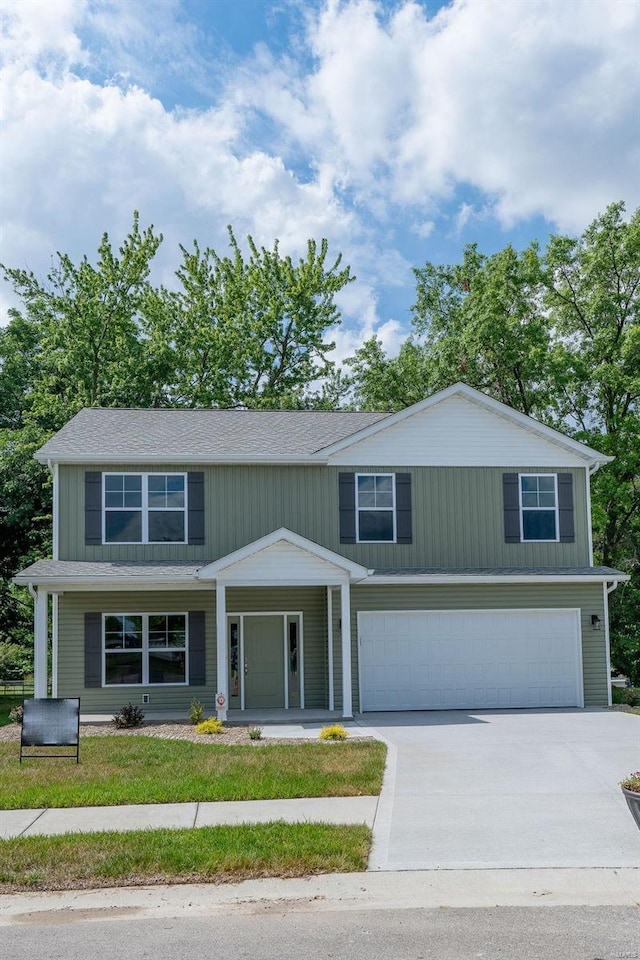 1461 Lexi Ln, Mascoutah, IL 62258 - view of front of home featuring a garage, concrete driveway, and covered porch
