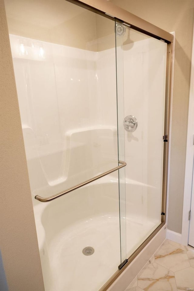 1461 Lexi Ln, Mascoutah, IL 62258 - full bathroom with a shower stall, marble finish floors, and baseboards