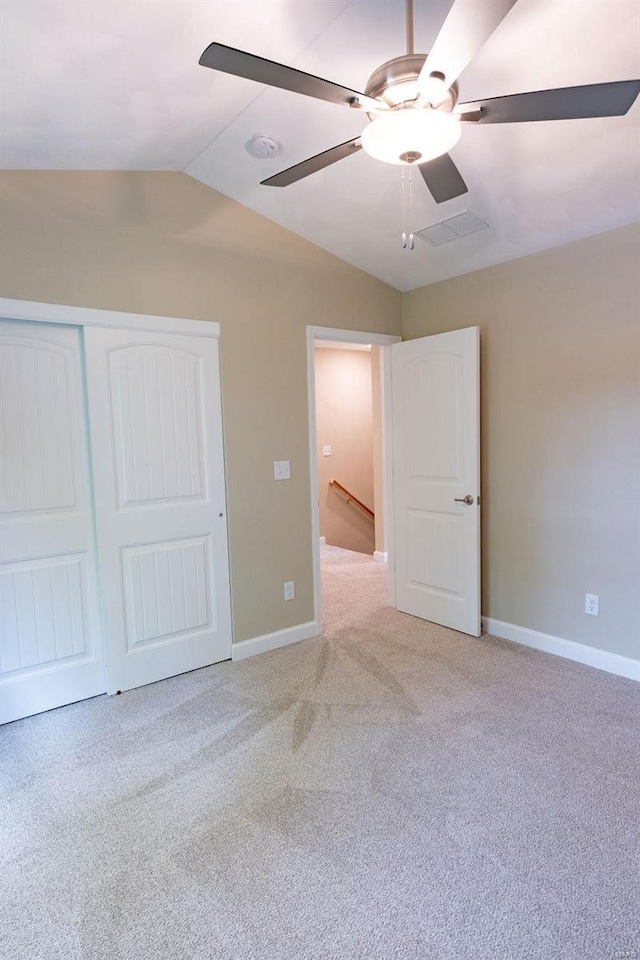 1461 Lexi Ln, Mascoutah, IL 62258 - unfurnished bedroom featuring vaulted ceiling, light colored carpet, baseboards, a closet, and ceiling fan