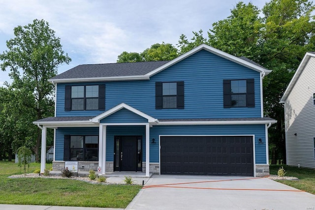 1453 Lexi Ln, Mascoutah, IL 62258 - view of front of property with a garage, stone siding, covered porch, a front yard, and concrete driveway