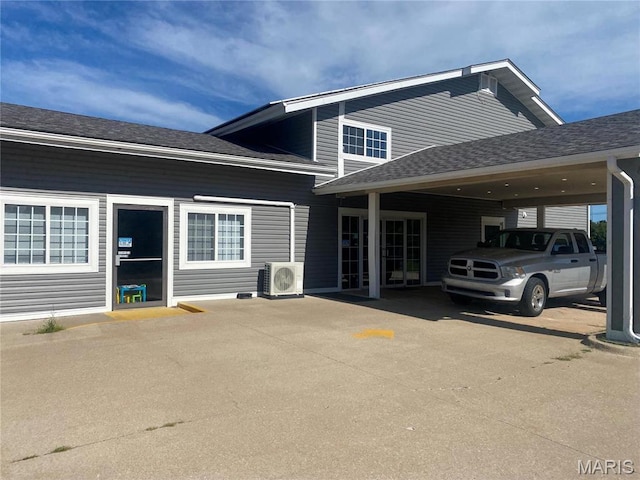 1 Proactive Dr, New Florence, MO 63363 - back of house with ac unit and roof with shingles