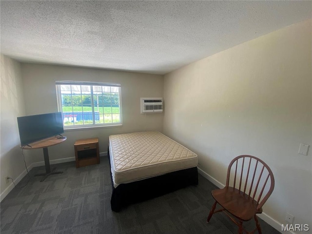 1 Proactive Dr, New Florence, MO 63363 - bedroom with a wall mounted air conditioner, carpet floors, baseboards, and a textured ceiling