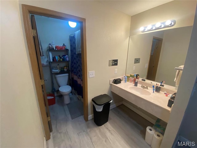 1 Proactive Dr, New Florence, MO 63363 - full bathroom featuring wood finished floors, toilet, and vanity
