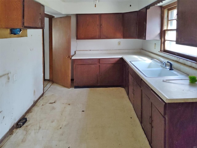 2129 Red Bud Dr, Bonne Terre, MO 63628 - kitchen featuring a sink, light countertops, light floors, and baseboards