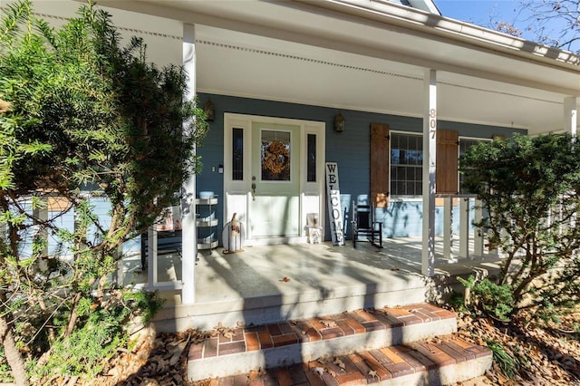 property entrance with covered porch
