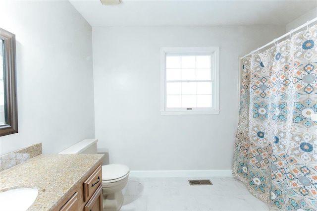 full bathroom with vanity, marble finish floors, toilet, and baseboards
