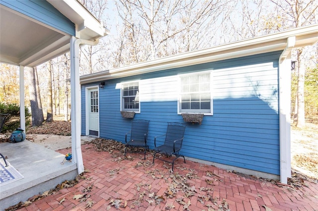 view of side of home with a patio area