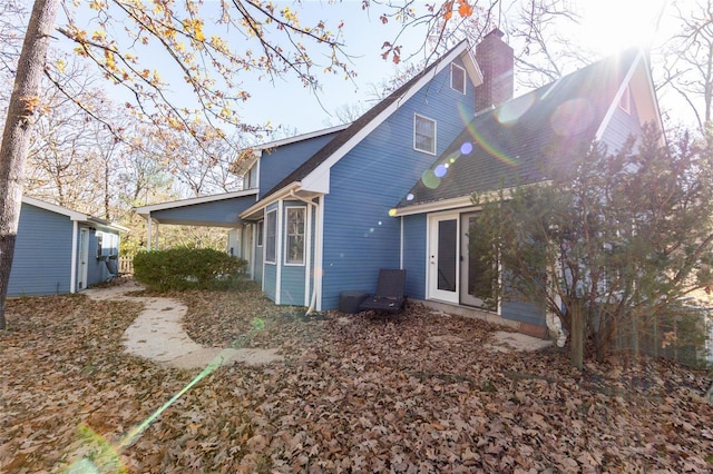 rear view of house with a chimney