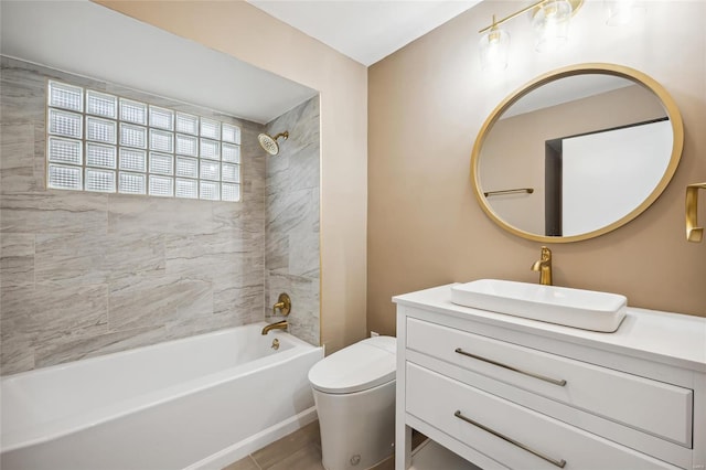 full bathroom featuring toilet, shower / bathtub combination, and vanity