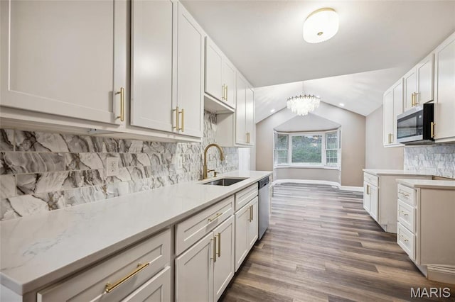 15 Chamblee Ln, Saint Louis, MO 63141 - kitchen with a sink, stainless steel appliances, wood finished floors, lofted ceiling, and baseboards