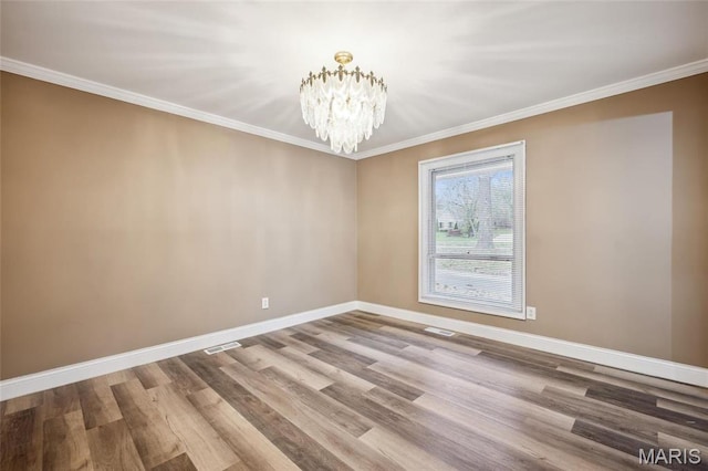 15 Chamblee Ln, Saint Louis, MO 63141 - unfurnished room featuring a chandelier, baseboards, wood finished floors, and ornamental molding