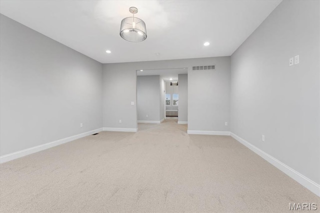 unfurnished room with baseboards, light colored carpet, and recessed lighting