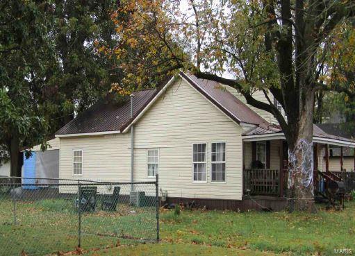 back of house with covered porch
