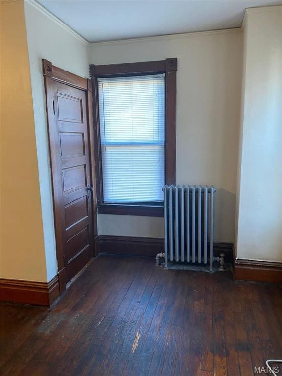 125 S 5th, Saint Charles, MO 63301 - unfurnished room featuring radiator heating unit, wood-type flooring, crown molding, and baseboards