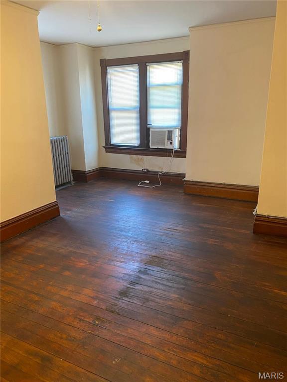 125 S 5th, Saint Charles, MO 63301 - unfurnished room with radiator heating unit, dark wood-style flooring, cooling unit, and baseboards