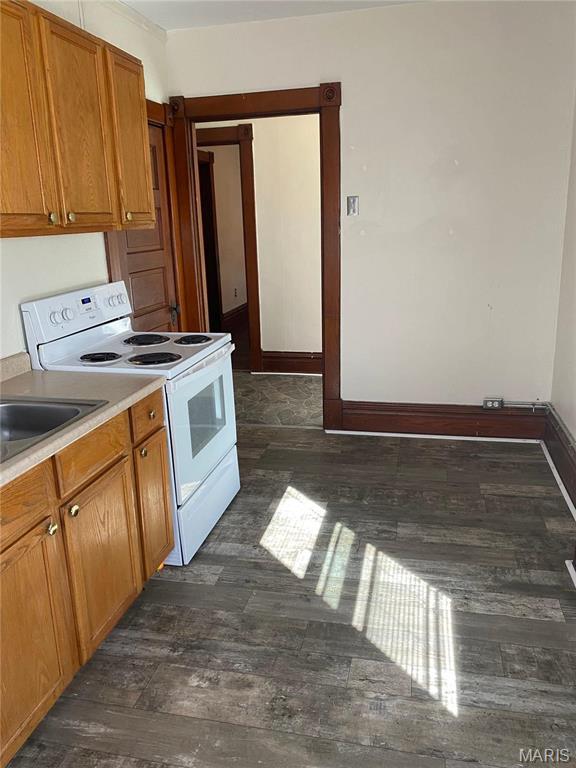 125 S 5th, Saint Charles, MO 63301 - kitchen featuring electric stove, dark wood-style floors, brown cabinets, and light countertops