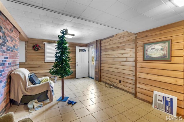11 Schonhoff Cpe, Girardeau, MO 63703 - living area featuring wood walls, light tile patterned floors, and healthy amount of natural light