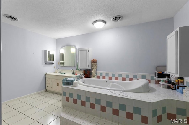 11 Schonhoff Cpe, Girardeau, MO 63703 - bathroom with tile patterned flooring, a bath, vanity, and a textured ceiling