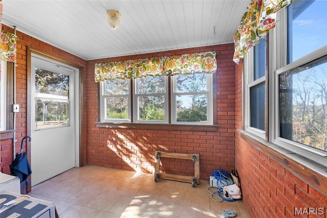 11 Schonhoff Cpe, Girardeau, MO 63703 - unfurnished sunroom with brick wall, tile patterned floors, and wooden ceiling
