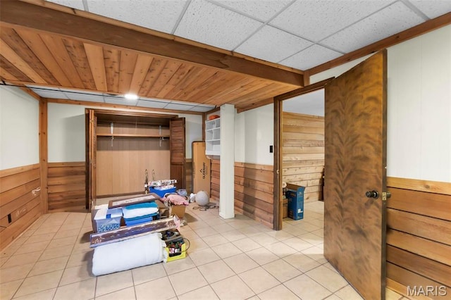 11 Schonhoff Cpe, Girardeau, MO 63703 - bathroom featuring wooden walls, tile patterned floors, and a wainscoted wall