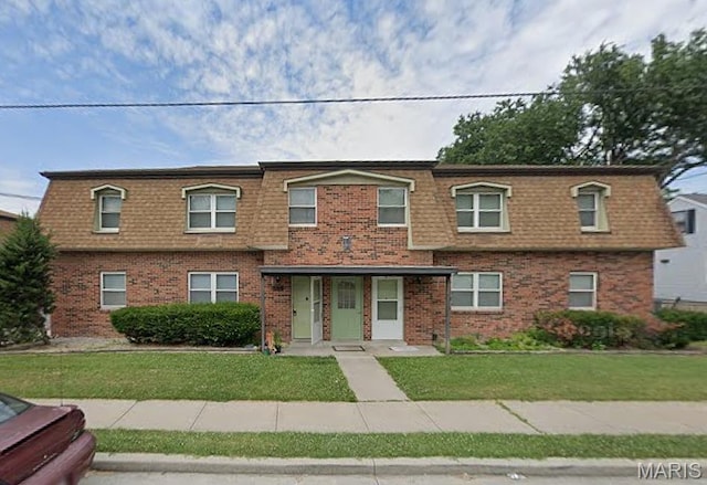 753 Rozier St, Saint Genevieve, MO 63670 - view of front of house with mansard roof, a front lawn, brick siding, and roof with shingles