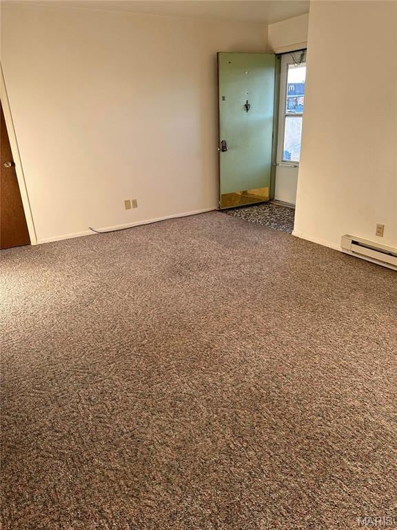 753 Rozier St, Saint Genevieve, MO 63670 - empty room with carpet flooring and a baseboard radiator