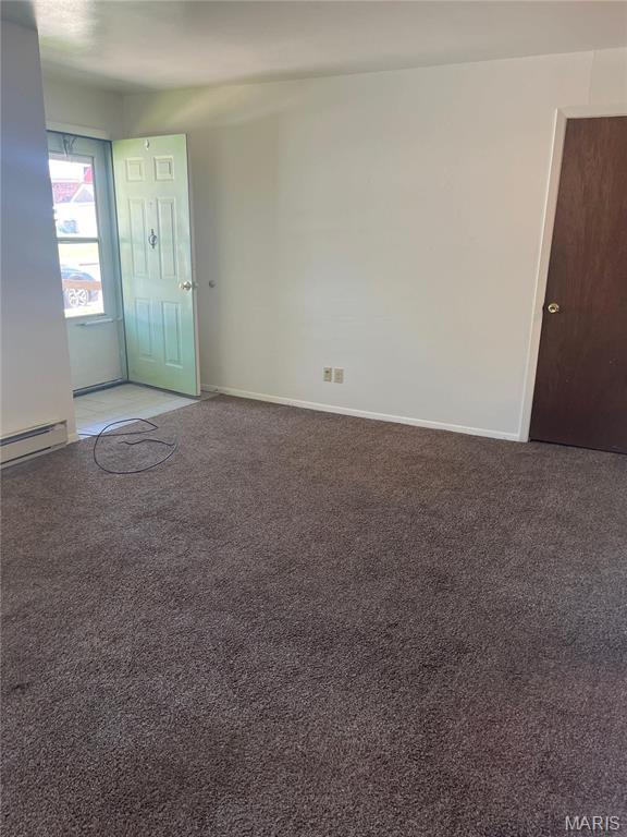 753 Rozier St, Saint Genevieve, MO 63670 - empty room with light carpet, baseboard heating, and baseboards