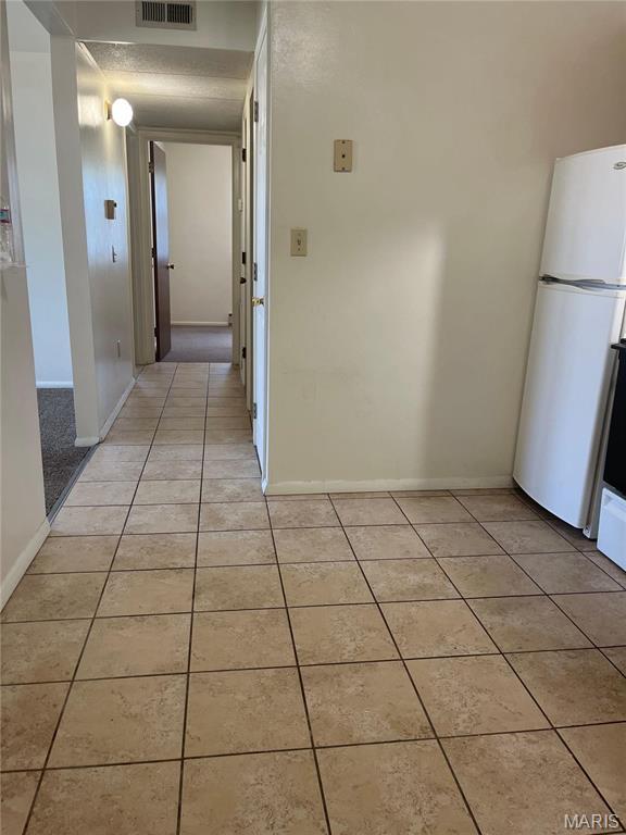 753 Rozier St, Saint Genevieve, MO 63670 - hall featuring light tile patterned flooring and baseboards