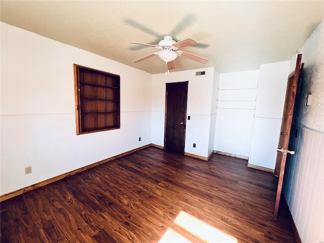 16144 Horse Shoe Dr, Houston, MO 65483 - empty room with ceiling fan, dark wood-style floors, baseboards, and built in shelves