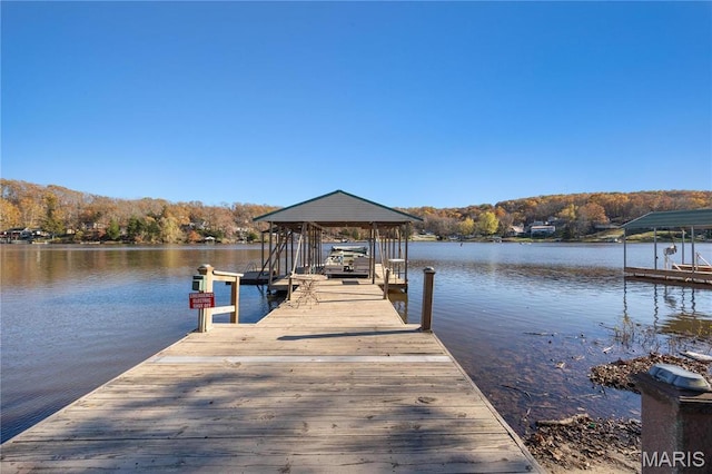 9136 Beach Dr, French Village, MO 63036 - dock with a water view, boat lift, and a view of trees