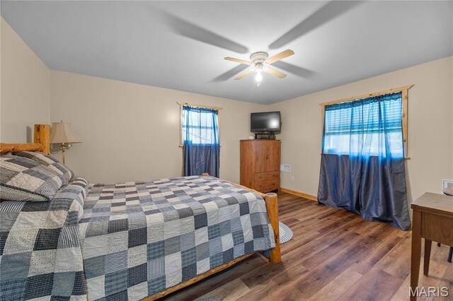 9136 Beach Dr, French Village, MO 63036 - bedroom with wood finished floors, ceiling fan, and baseboards