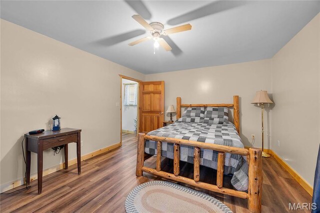 9136 Beach Dr, French Village, MO 63036 - bedroom featuring baseboards, wood finished floors, and a ceiling fan