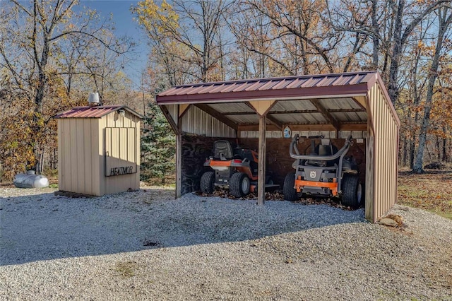 10450 Ok Rd, Bonne Terre, MO 63628 - view of vehicle parking featuring a carport and a storage shed