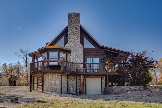 10450 Ok Rd, Bonne Terre, MO 63628 - rear view of house featuring stone siding, a deck, and a chimney