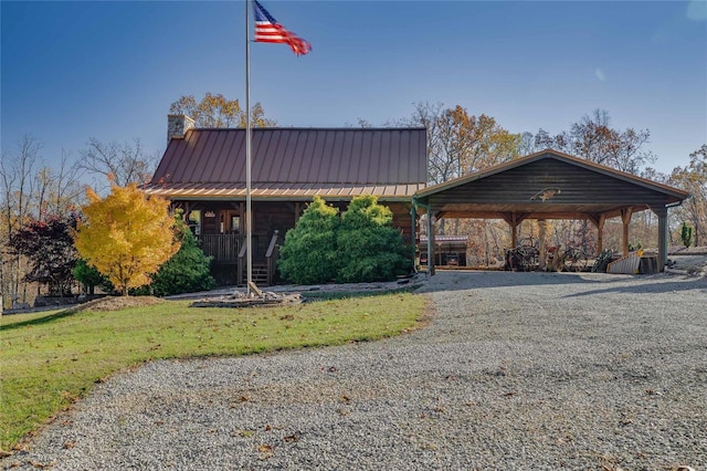 10450 Ok Rd, Bonne Terre, MO 63628 - view of front of property featuring a chimney, covered porch, a standing seam roof, and driveway