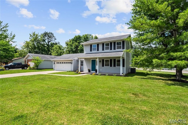 1 Germania, Columbia, IL 62236 - view of front of home with concrete driveway, an attached garage, a front lawn, and a porch