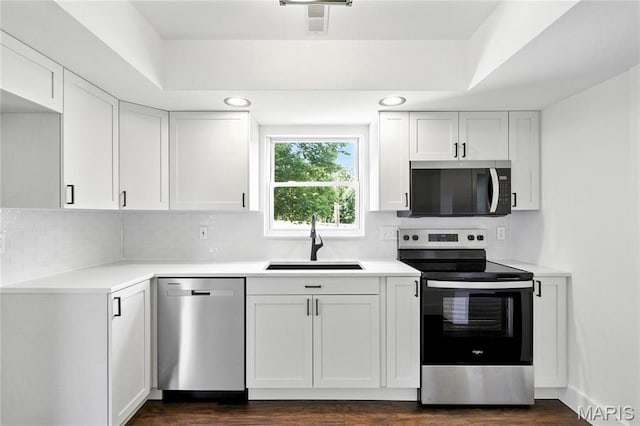 1 Germania, Columbia, IL 62236 - kitchen with stainless steel appliances, white cabinets, tasteful backsplash, light countertops, and recessed lighting