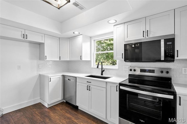 1 Germania, Columbia, IL 62236 - kitchen with stainless steel appliances, white cabinets, backsplash, light countertops, and recessed lighting
