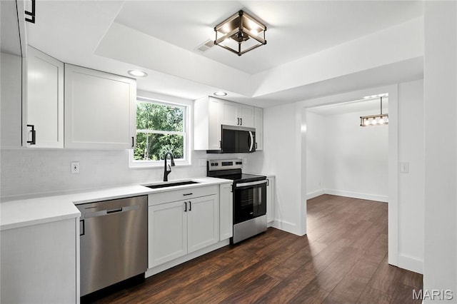 1 Germania, Columbia, IL 62236 - kitchen with stainless steel appliances, tasteful backsplash, recessed lighting, dark wood-type flooring, and light countertops