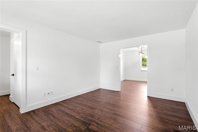 1 Germania, Columbia, IL 62236 - spare room with dark wood-style floors and baseboards