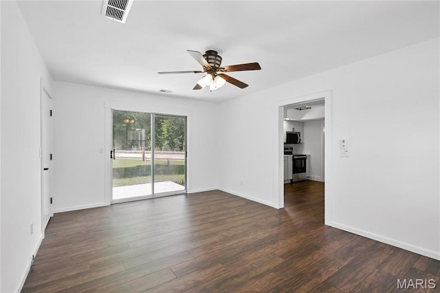 1 Germania, Columbia, IL 62236 - empty room with a ceiling fan and dark wood finished floors