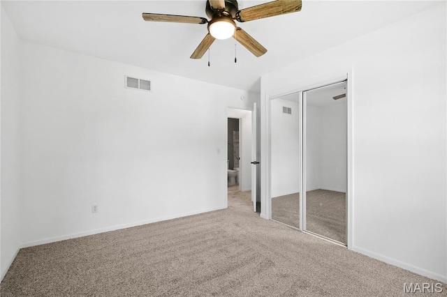 1 Germania, Columbia, IL 62236 - unfurnished bedroom featuring carpet flooring, a closet, and ceiling fan