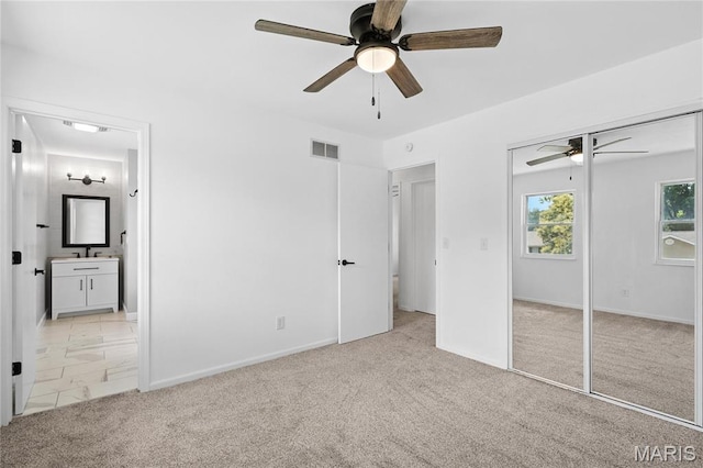 1 Germania, Columbia, IL 62236 - unfurnished bedroom with carpet floors, ensuite bathroom, a closet, and ceiling fan