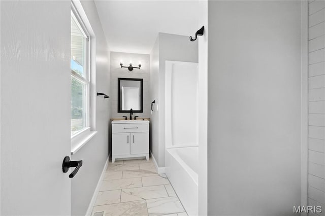 1 Germania, Columbia, IL 62236 - bathroom featuring marble look tile flooring, vanity, and tub / shower combination
