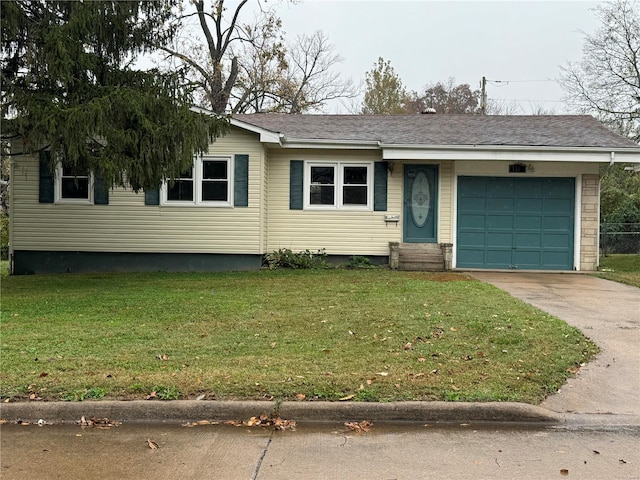 view of front facade with a front yard, an attached garage, driveway, and entry steps