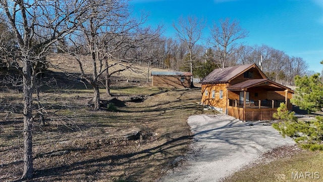 9454 Little Indian Creek Rd, Lonedell, MO 63060 - view of front of house featuring a wooden deck and dirt driveway