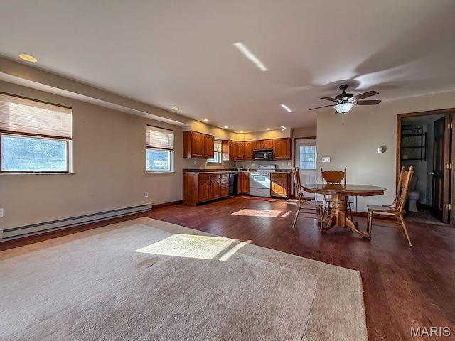 9454 Little Indian Creek Rd, Lonedell, MO 63060 - kitchen featuring black appliances, a baseboard radiator, brown cabinets, dark wood-style flooring, and recessed lighting