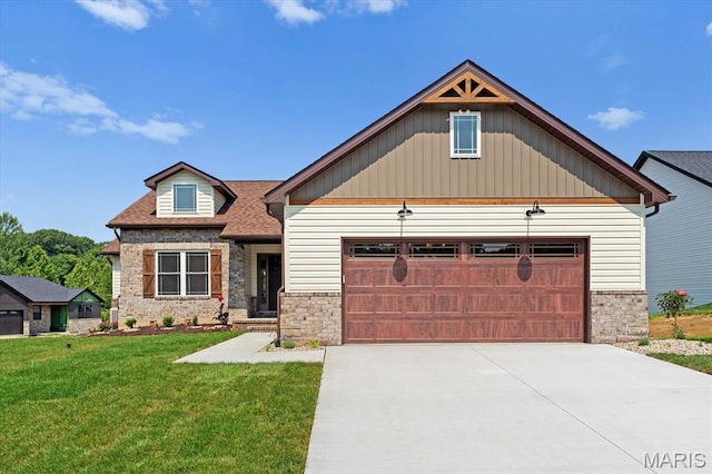 955 Half Moon Ln, Caseyville, IL 62232 - craftsman inspired home featuring stone siding, a front lawn, driveway, an attached garage, and board and batten siding